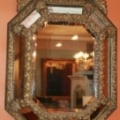 Multi-faceted octagonal mirror with elegant detail and shape