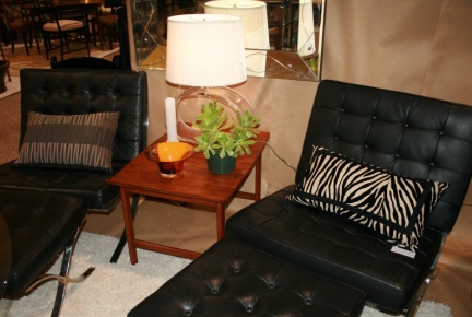 Pair of Ludwig Mies van der Rohe black leather Barcelona chairs with ottomans