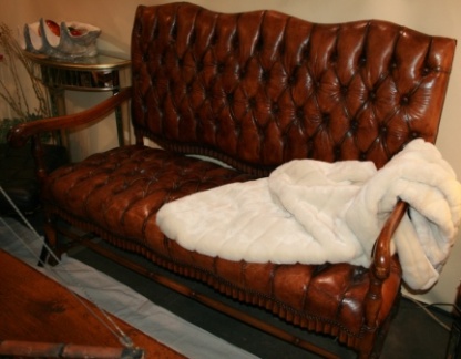 Tufted Leather Settee with Handsome Hand Carved Details