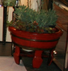 Chinese round wooden container in a Chinese red lacquer finish.