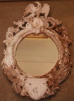 American antique cast iron framed mirror with eagle form at top and shield at bottom