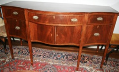 Antique American Federal mahogany sideboard with serpentine shape and beautiful inlay.  66" wide x 25" & 18" deep and 40" high.  Very fine condition.