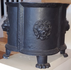Pair of antique black cast iron jardiniere with lion decor