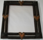 Tramp art frame with hearts