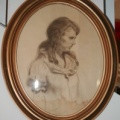 Oval framed drawing of a woman