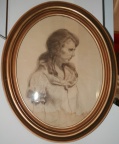 Oval framed drawing of a woman