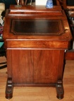 Antique Captain's writing desk with stamped leather writing surface that lifts open.  Four side drawers.  Fine inlaid design.