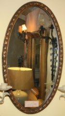 Oval gold framed mirror