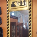 Antique Empire gold framed mirror with black accent