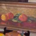 Early oil painting of peaches, in a frame