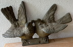 Charming pair of birds sculpted of heavy metal with exceptional feather detail. Perhaps originally a top ornament for a gate or a metal garden bench, they would be lovely indoors on a shelf display or as a lovely garden surprise. Measures approximately 9.