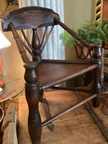 Antique English three-legged Turner's Chair from the 1600s. Turner's chairs were created by professional wood turners to showcase their exceptional skill level. The three-legged structure of the chair ensures stability on uneven surfaces, such as in Tudor